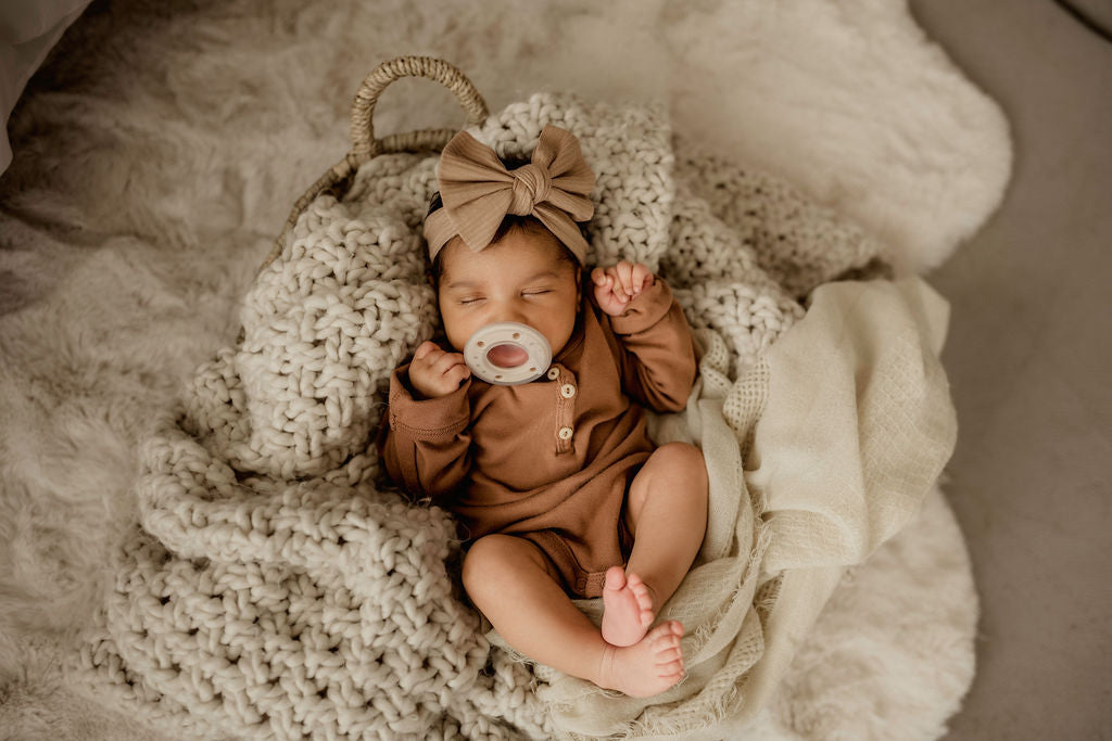 baby using breastlike pacifier